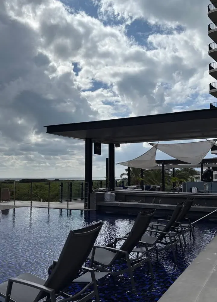 The infinity pool at Sky Bar by BATIDA in Ishigaki — blue water and the sea beyond